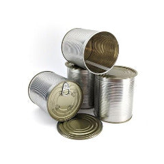 Four cans - two upright, two on their side. One is empty, one with lid attached, one upside-down, and one hard to tell. Also, a lid.